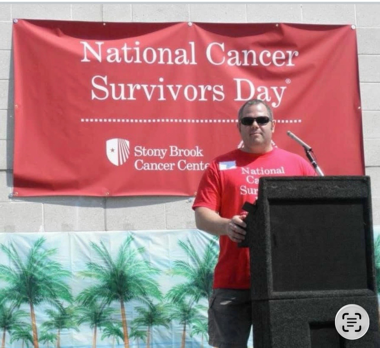 Man speaking at National Cancer Survivors Day event